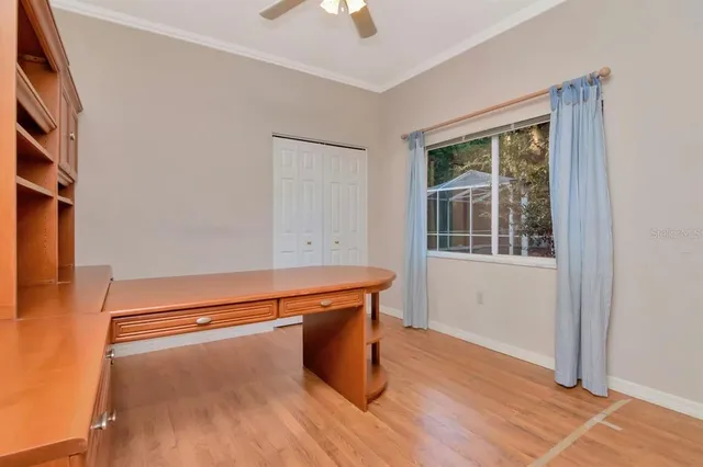 a view of an empty room with a fireplace and a window