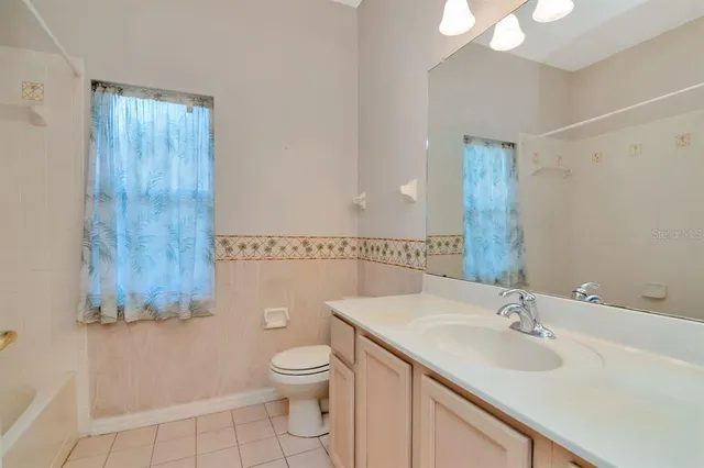 a view of a room with cabinet and a large window