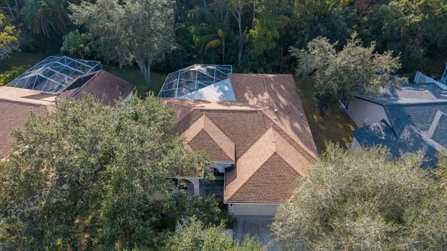 an aerial view of residential houses with outdoor space