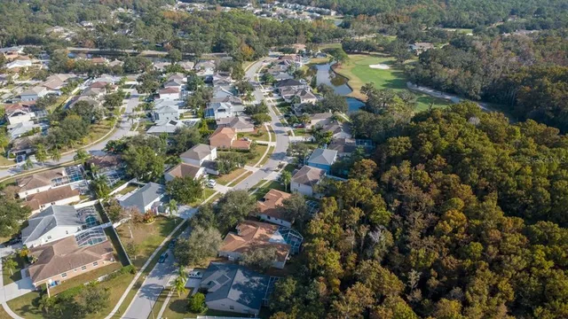 an aerial view of residential houses with outdoor space