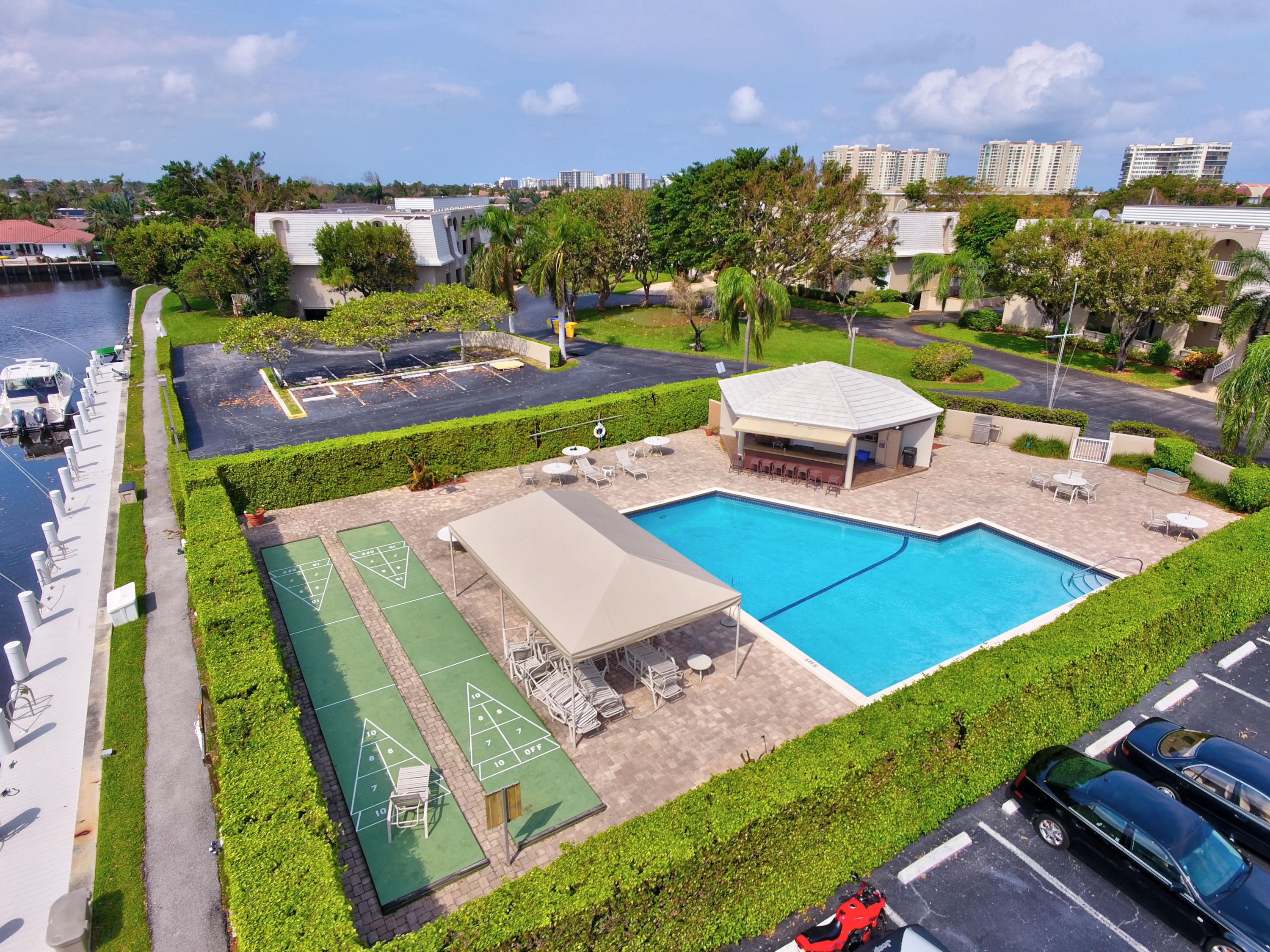 765 Jeffery Street, Unit 1306 Boca Raton, FL 33487 - Photo 30 of 34 a view of a chairs and table on the terrace