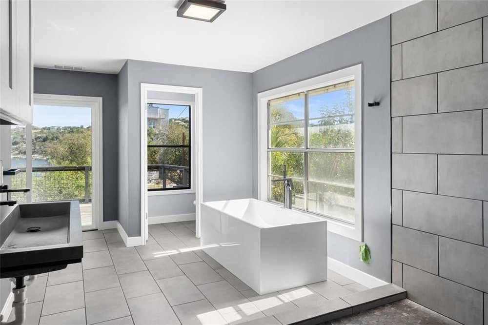20204 Barnett Glenn Road Spicewood, TX 78669 - Photo 20 of 34 a living room with large window