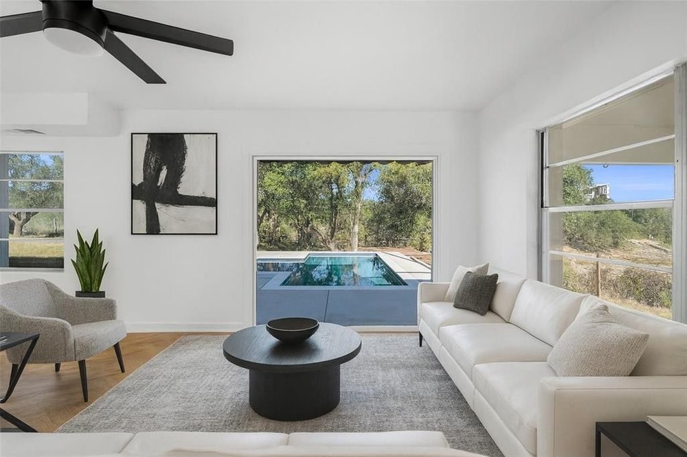 20204 Barnett Glenn Road Spicewood, TX 78669 - Photo 2 of 34 a living room with furniture and a potted plant