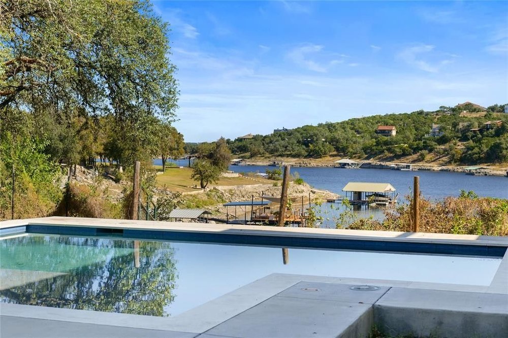 20204 Barnett Glenn Road Spicewood, TX 78669 - Photo 25 of 34 a view of a lake from a balcony