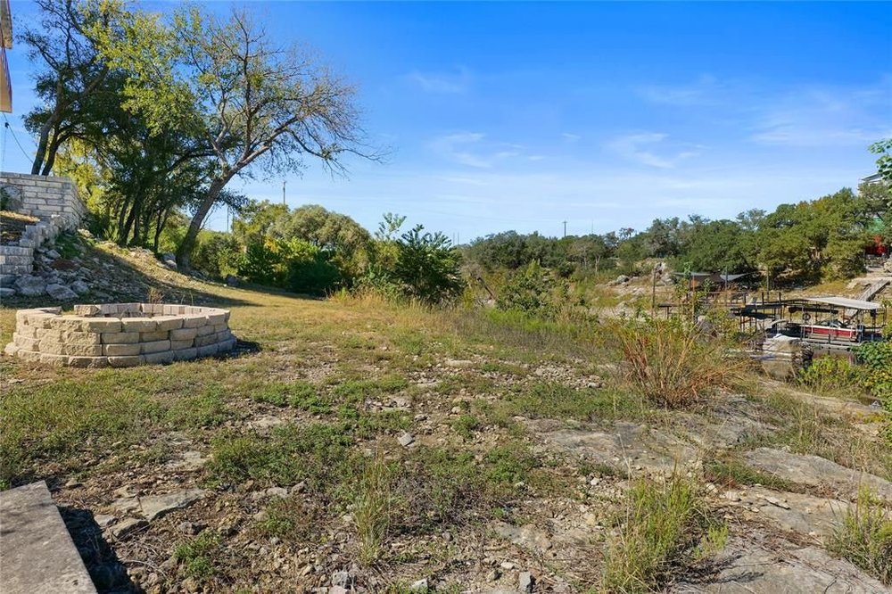 20204 Barnett Glenn Road Spicewood, TX 78669 - Photo 29 of 34 a view of a yard with an trees