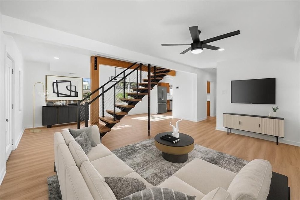 20204 Barnett Glenn Road Spicewood, TX 78669 - Photo 6 of 34 a living room with furniture and a flat screen tv