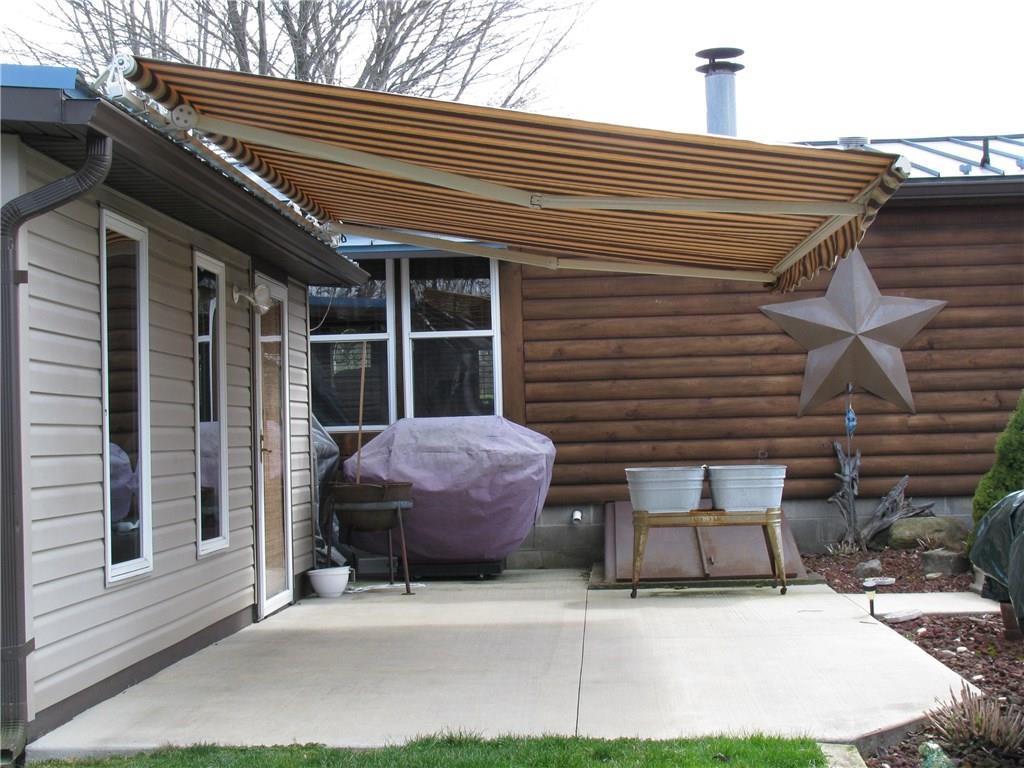 100 Leech Road Greenville, PA 16125 - Photo 5 of 23 RETRACTABLE AWNING OVER PATIO