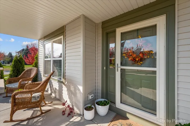 a view of a door and chair in the balcony