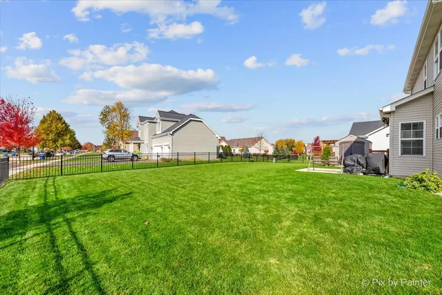 a view of yard with house and green space