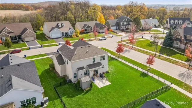an aerial view of a house with a swimming pool yard and mountain view