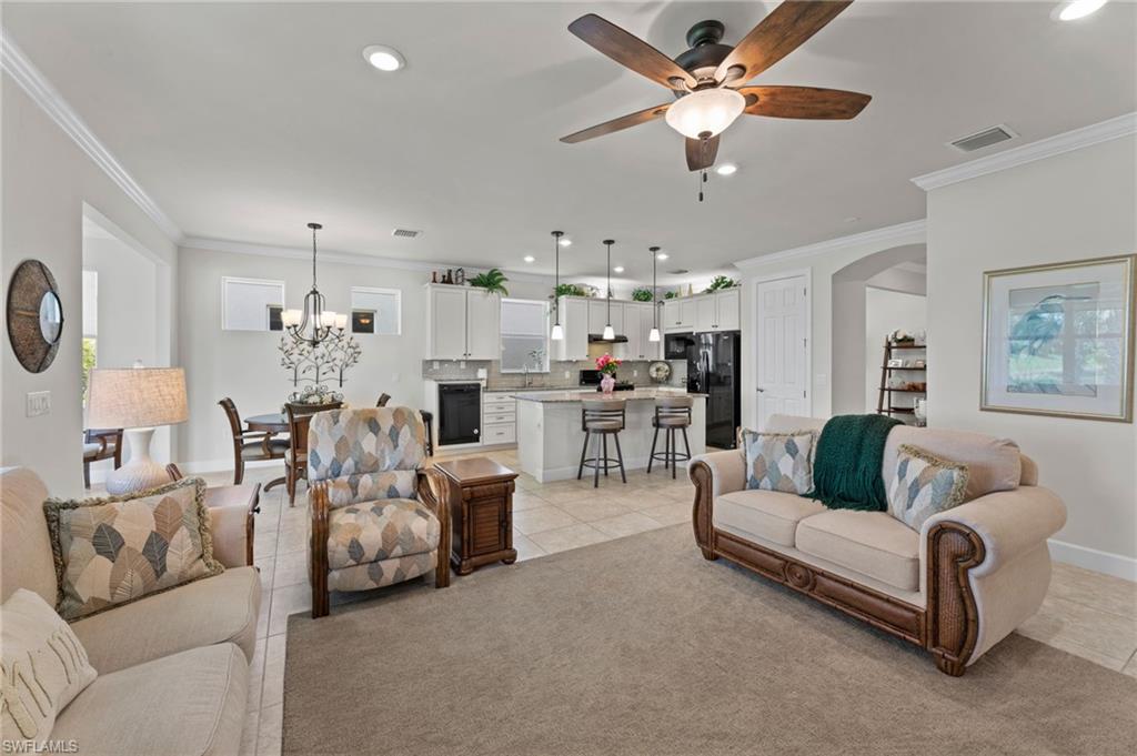 10507 Jackson Square Drive Estero, FL 33928 - Photo 11 of 46 a living room with furniture and a chandelier