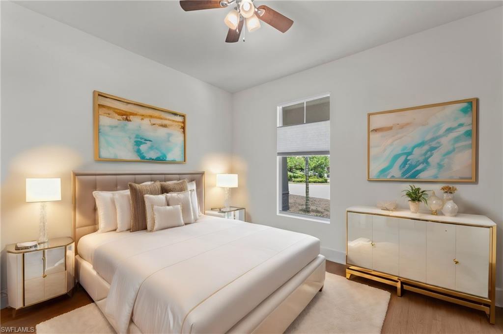 10507 Jackson Square Drive Estero, FL 33928 - Photo 26 of 46 a bedroom with a bed and a large window