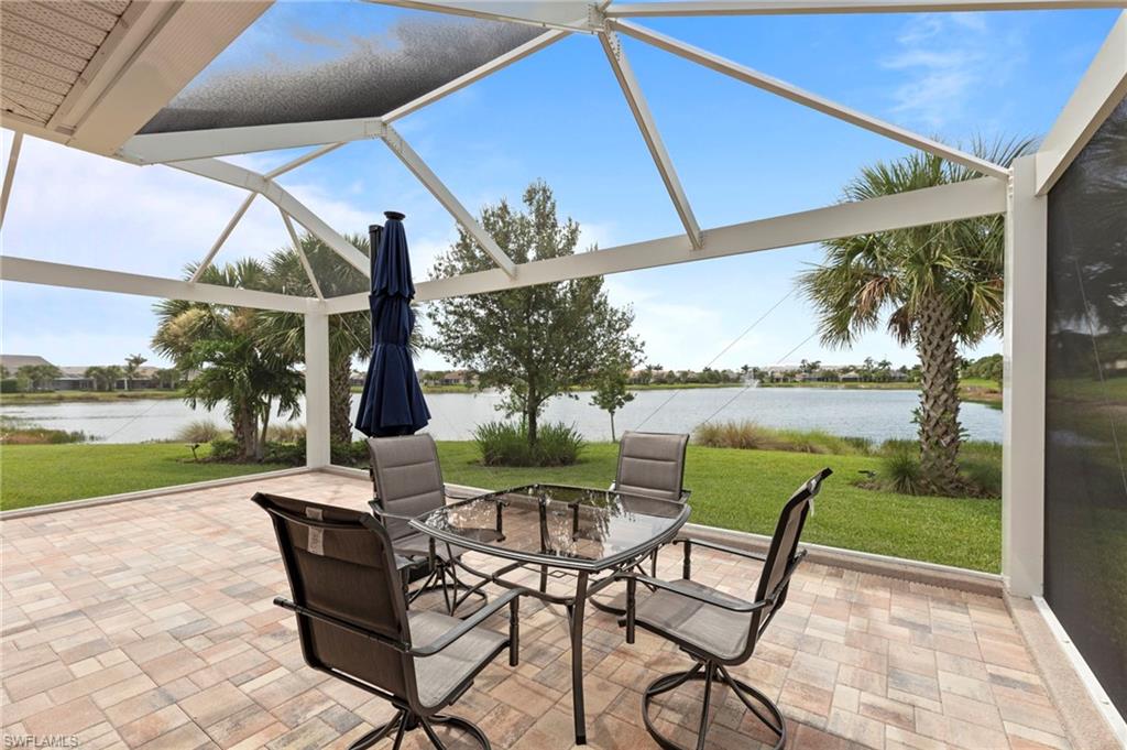 10507 Jackson Square Drive Estero, FL 33928 - Photo 30 of 46 a patio with glass top table and chairs