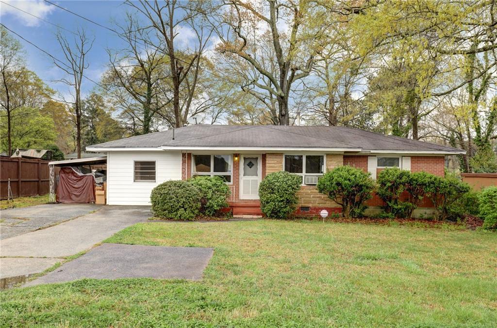 2708 Chamblee Tucker Road Chamblee, GA 30341 - Photo 1 of 1 a front view of a house with garden