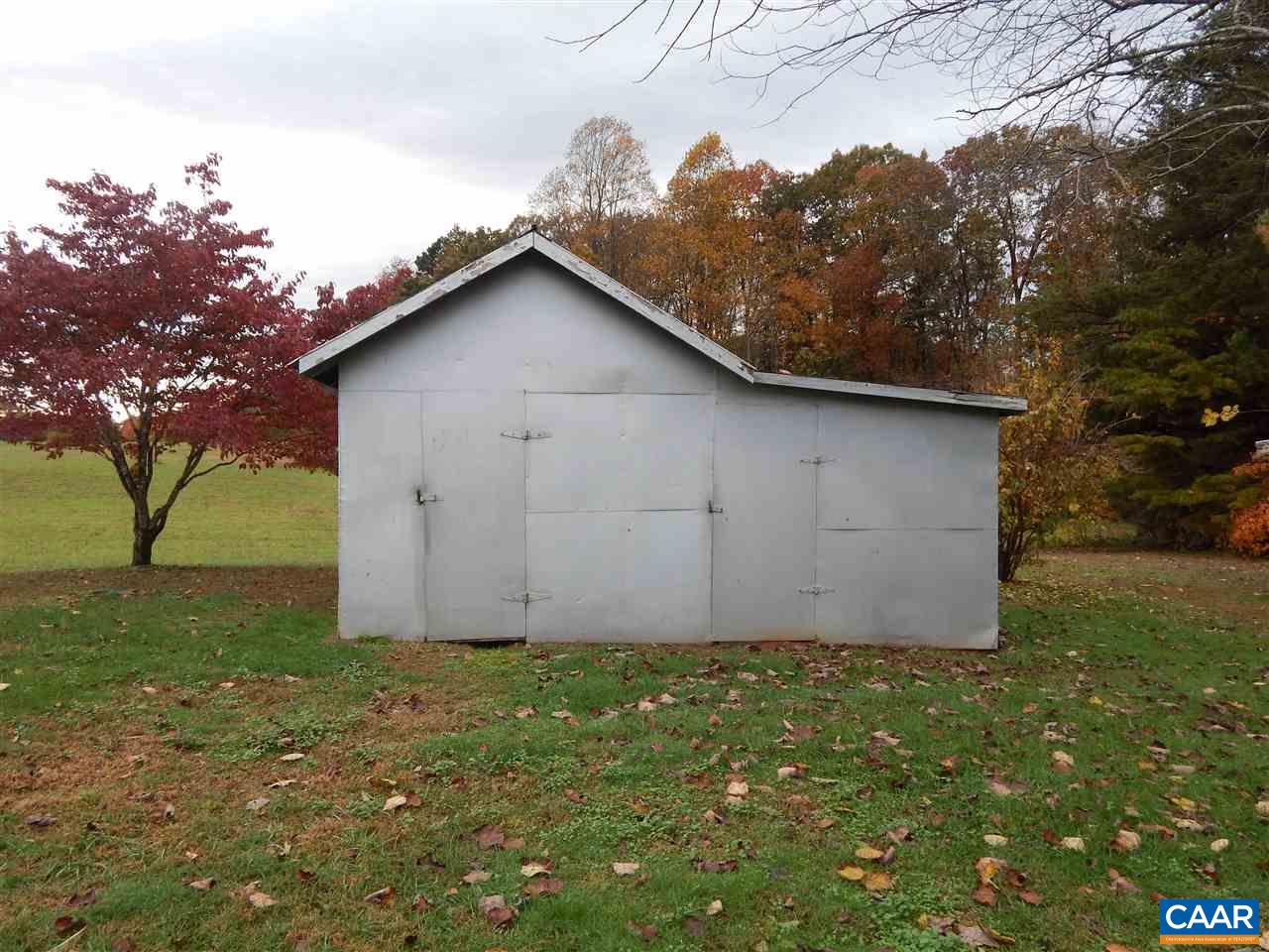4805 3 Notch Road Louisa, VA 23093 - Photo 17 of 22 a view of a backyard with large trees