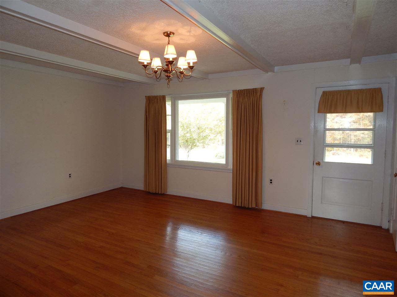 4805 3 Notch Road Louisa, VA 23093 - Photo 6 of 22 a view of an empty room with wooden floor and a window