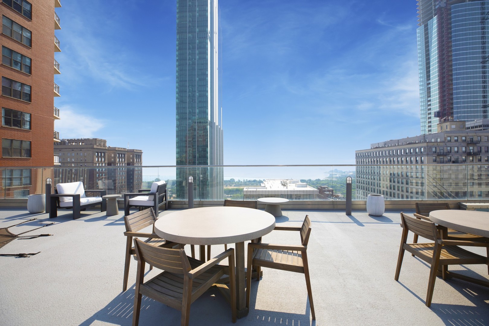 40 East 9th Street, Unit 1605 Chicago, IL 60605 - Photo 16 of 21 a balcony with table and chairs