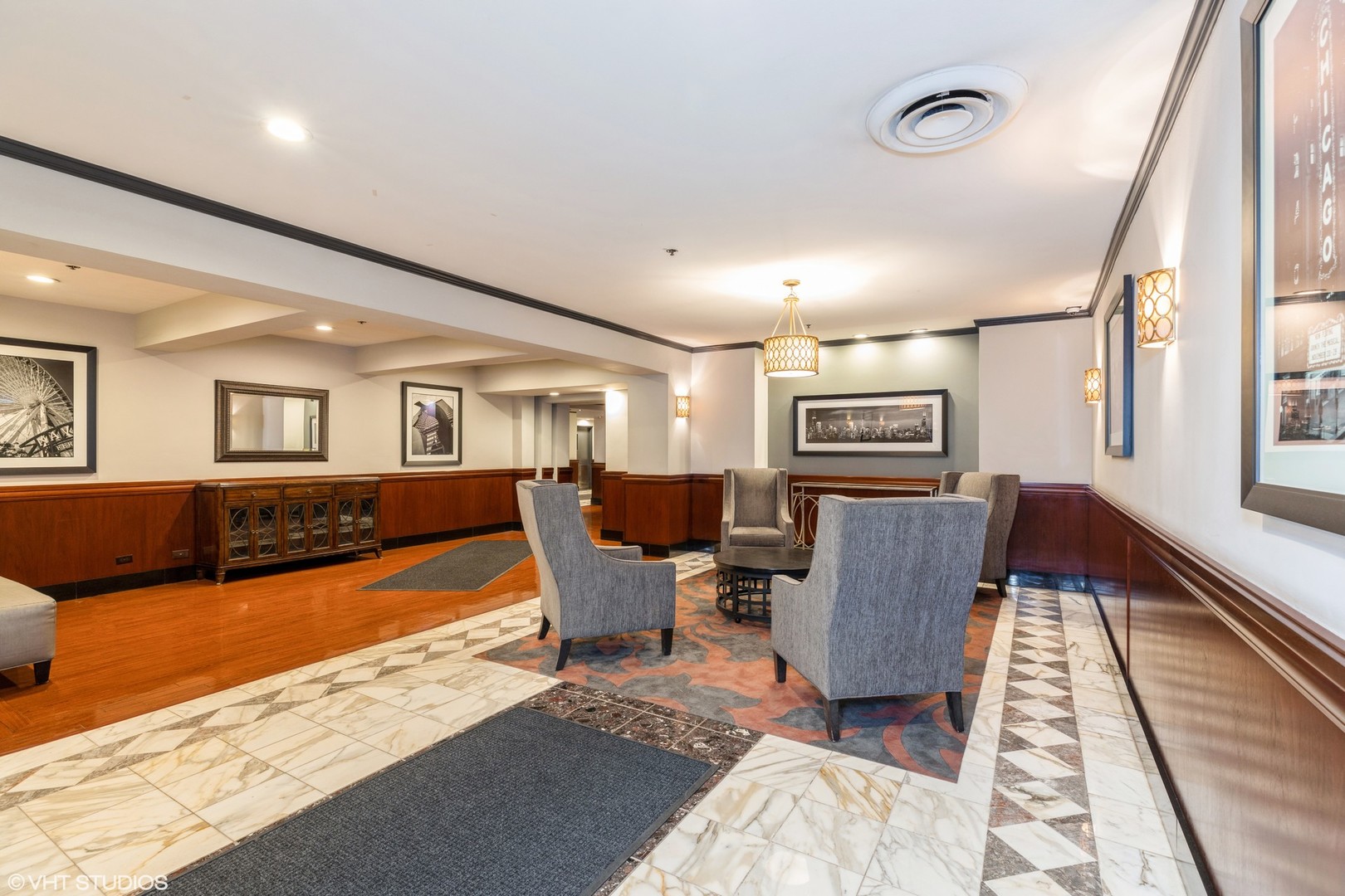 40 East 9th Street, Unit 1605 Chicago, IL 60605 - Photo 3 of 21 a living room with furniture and a flat screen tv
