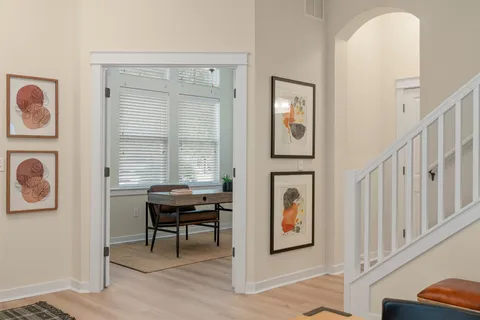 a view of a bedroom with furniture and windows