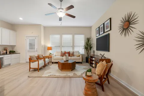 a living room with furniture fireplace and a flat screen tv