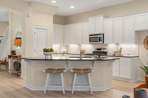 a kitchen with a sink and cabinets