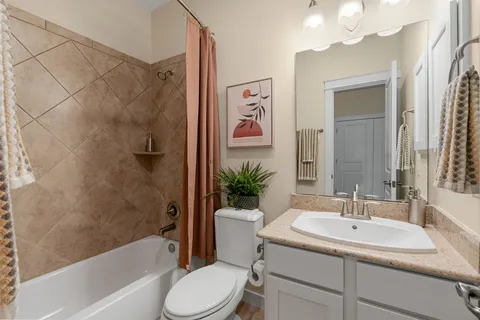 a bathroom with a sink a toilet and a bathtub