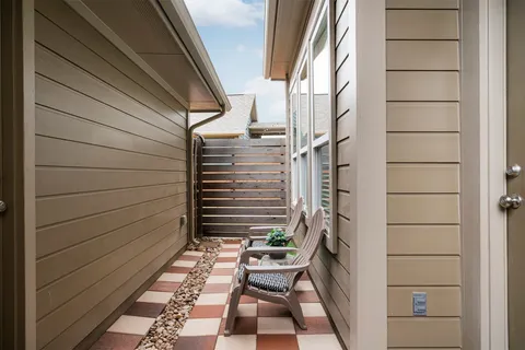 a view of balcony with chair and wooden floor