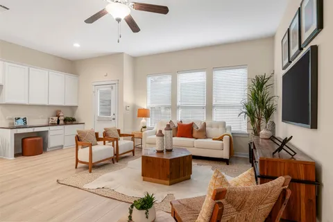 a living room with furniture fireplace and a flat screen tv
