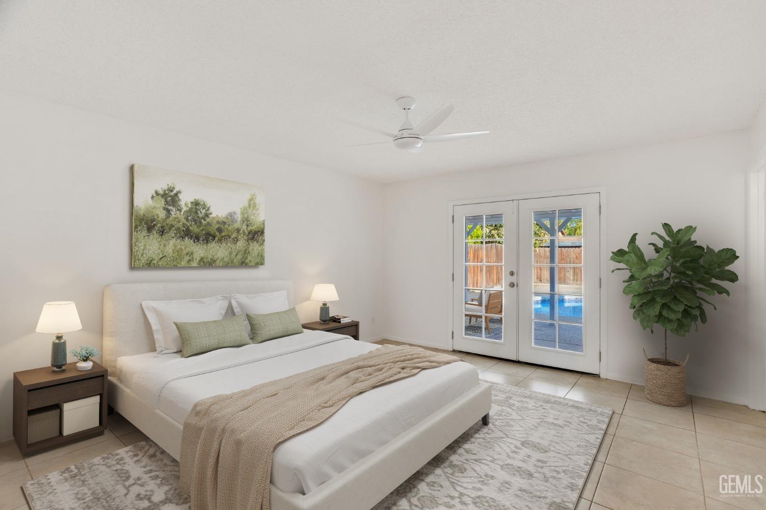 Undisclosed Address Bakersfield, CA 93304 - Photo 15 of 31 a bedroom with a large bed and a potted plant