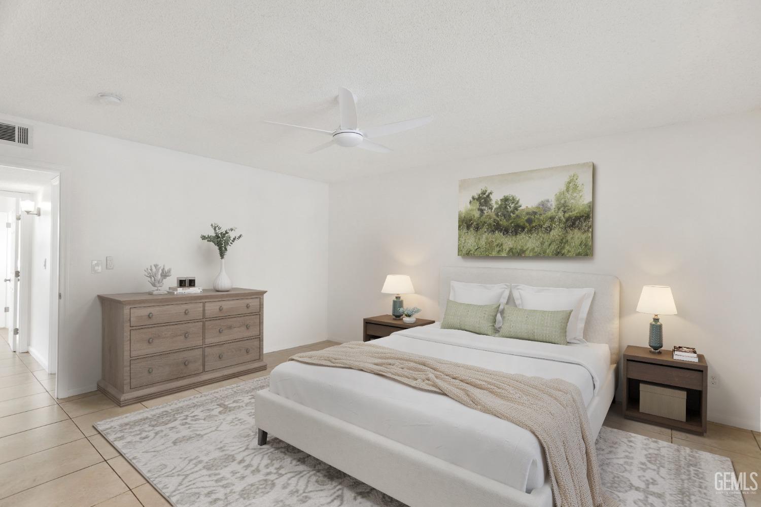 Undisclosed Address Bakersfield, CA 93304 - Photo 16 of 31 a bedroom with a bed and a chandelier