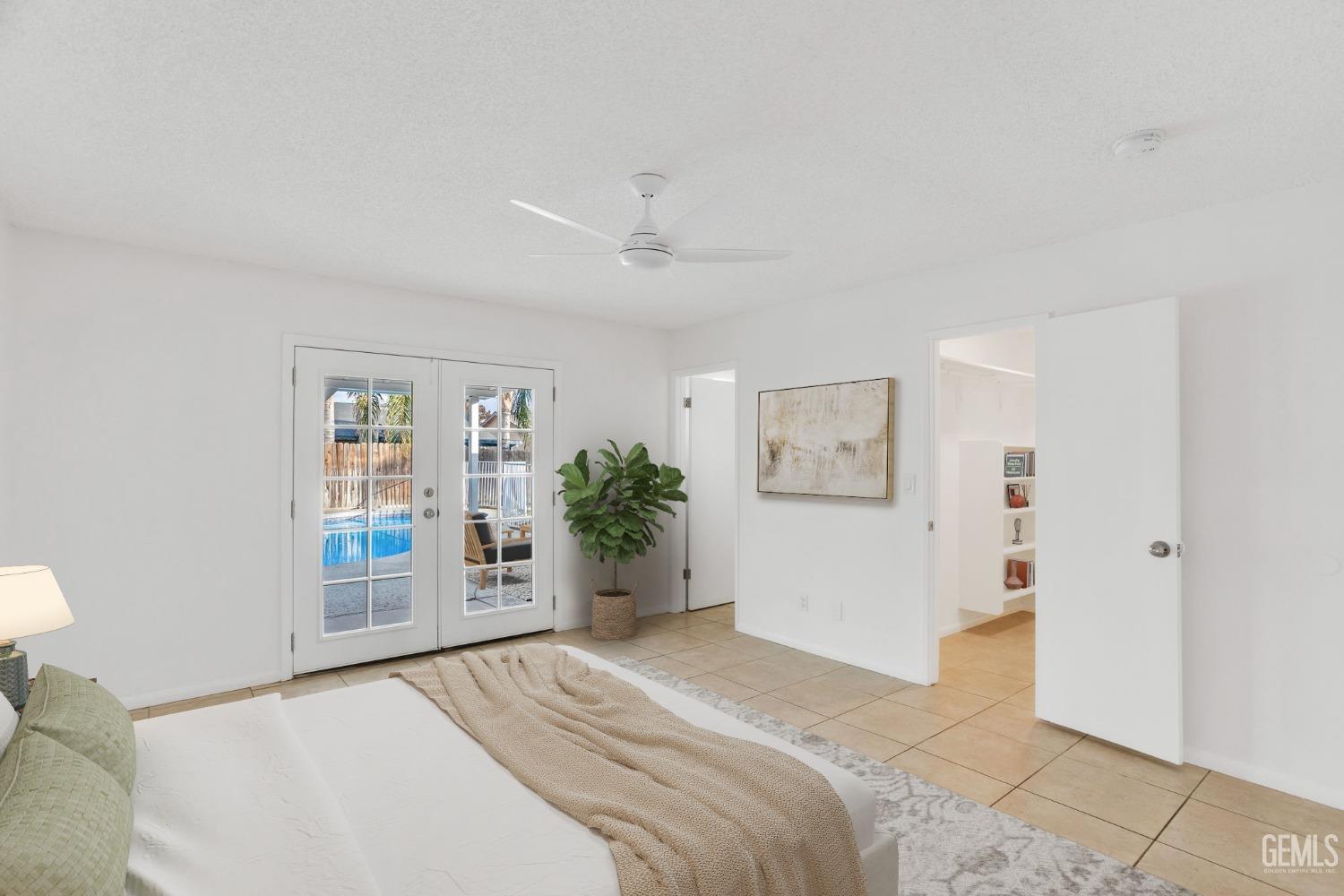 Undisclosed Address Bakersfield, CA 93304 - Photo 18 of 31 a bedroom with a large bed and a closet