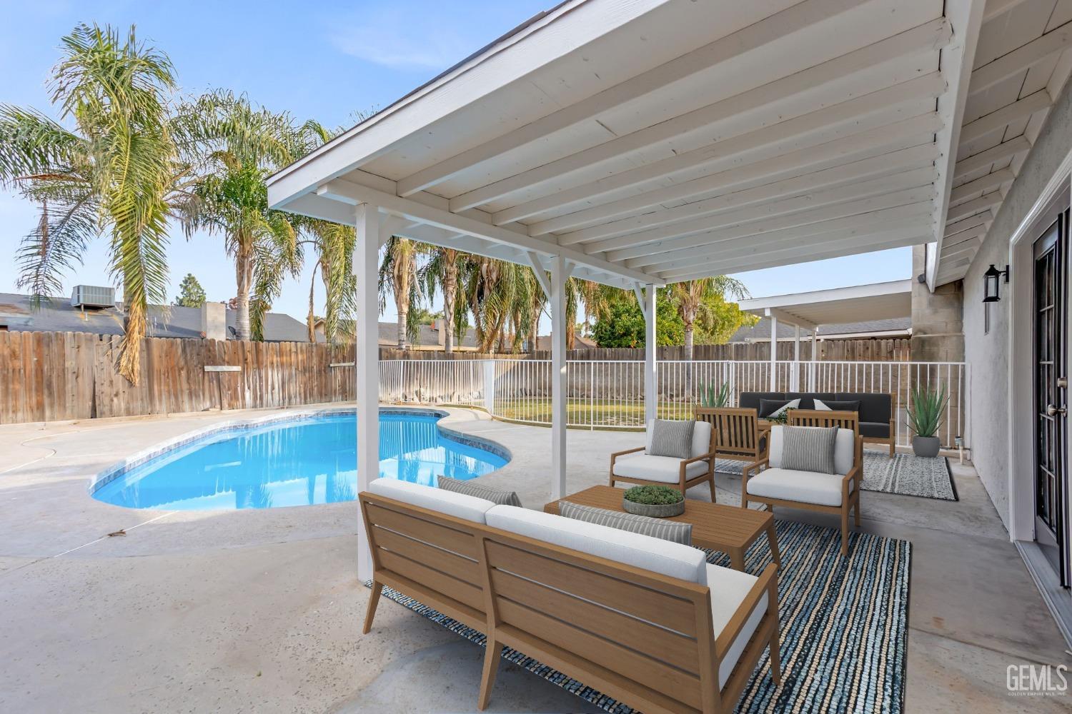 Undisclosed Address Bakersfield, CA 93304 - Photo 27 of 31 a view of swimming pool with outdoor seating