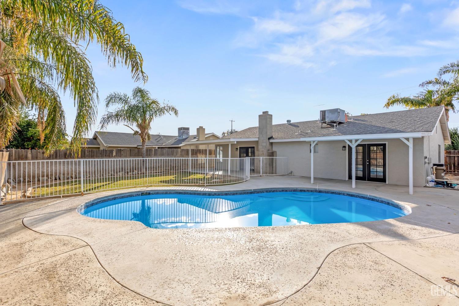 Undisclosed Address Bakersfield, CA 93304 - Photo 30 of 31 a view of a house with swimming pool and sitting area