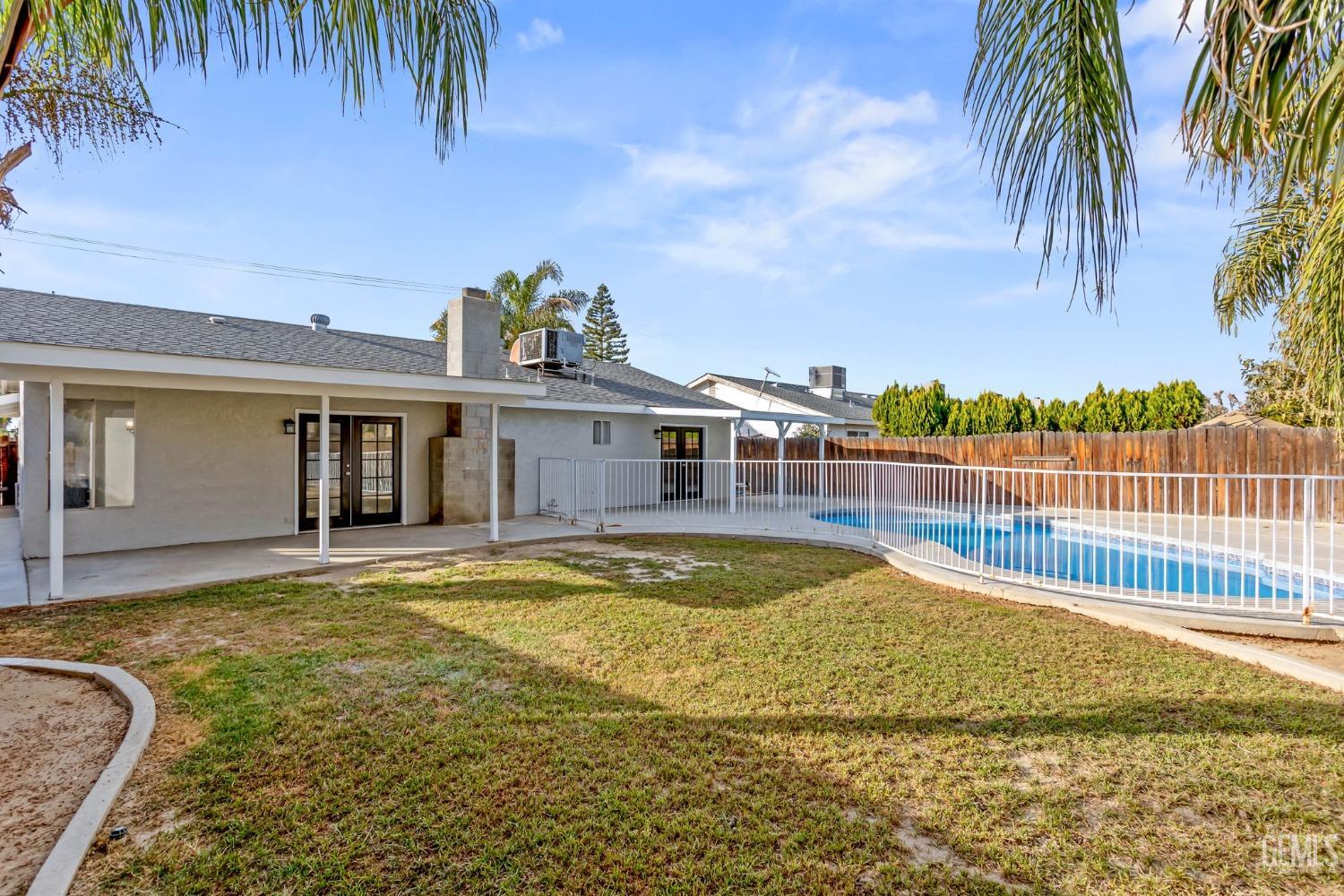 Undisclosed Address Bakersfield, CA 93304 - Photo 31 of 31 a view of a house with swimming pool and sitting area