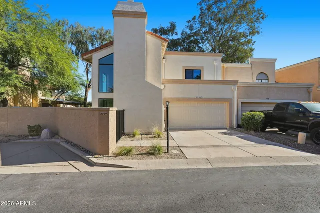 a picture of a bench in front of a wall