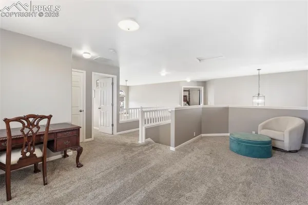 a view of a kitchen with furniture and a kitchen