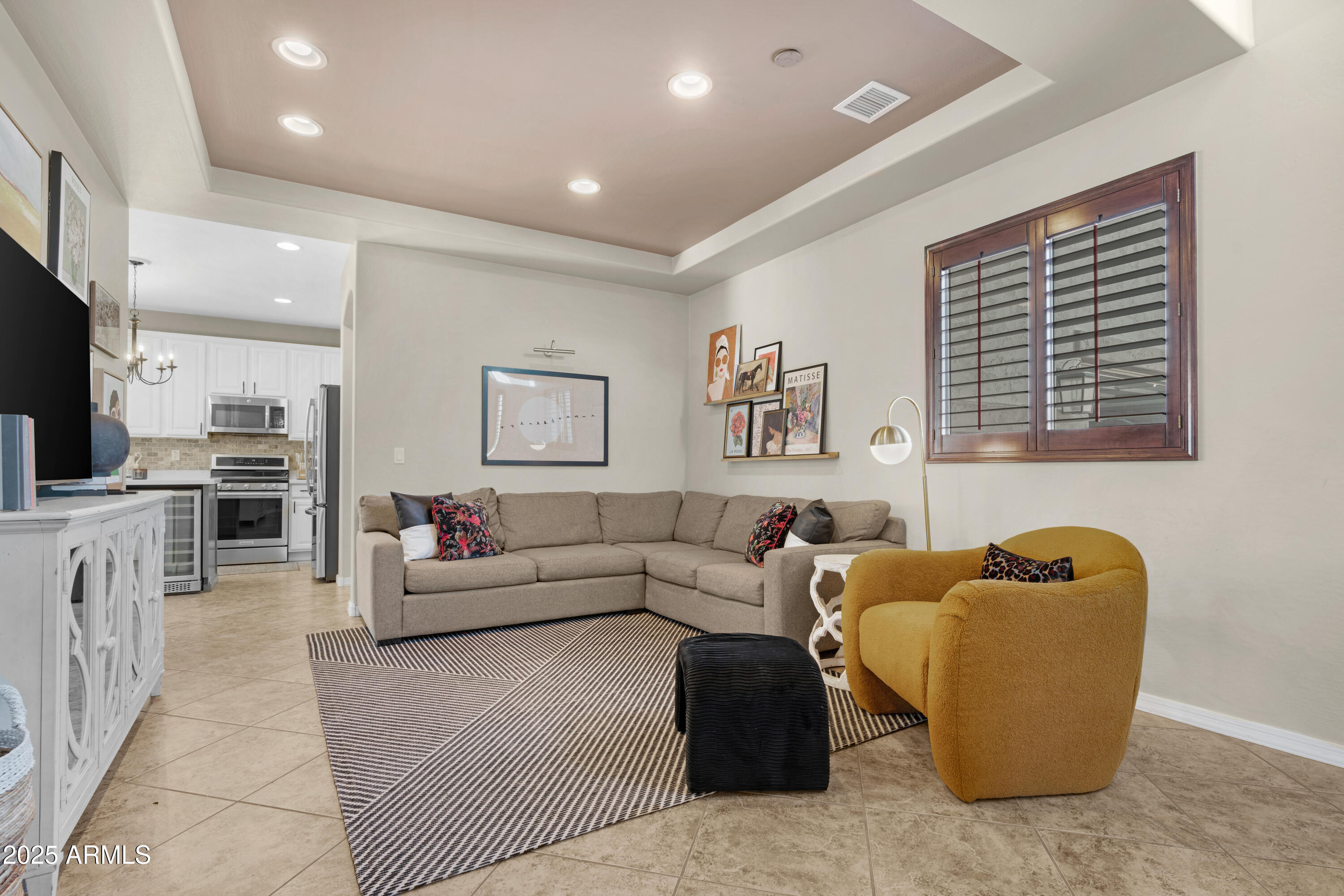 5419 West Tether Trail Phoenix, AZ 85083 - Photo 9 of 58 a living room with furniture and a flat screen tv