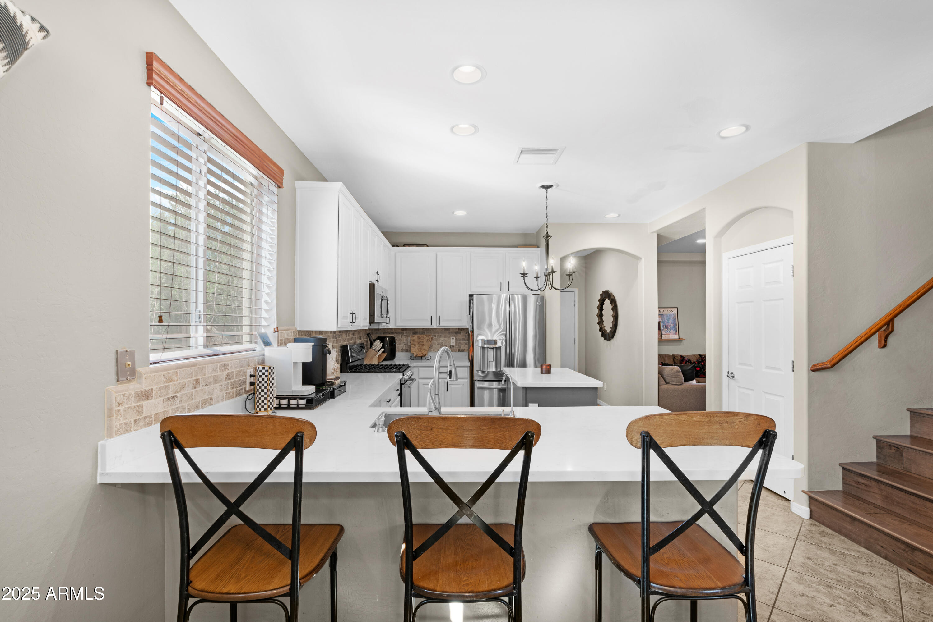 5419 West Tether Trail Phoenix, AZ 85083 - Photo 12 of 58 a view of a dining room with furniture and a table