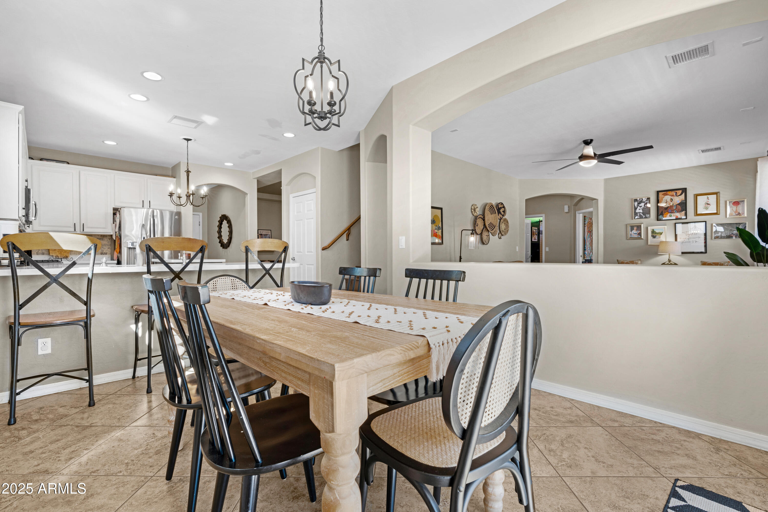 5419 West Tether Trail Phoenix, AZ 85083 - Photo 17 of 58 a view of a dining room with furniture and a chandelier