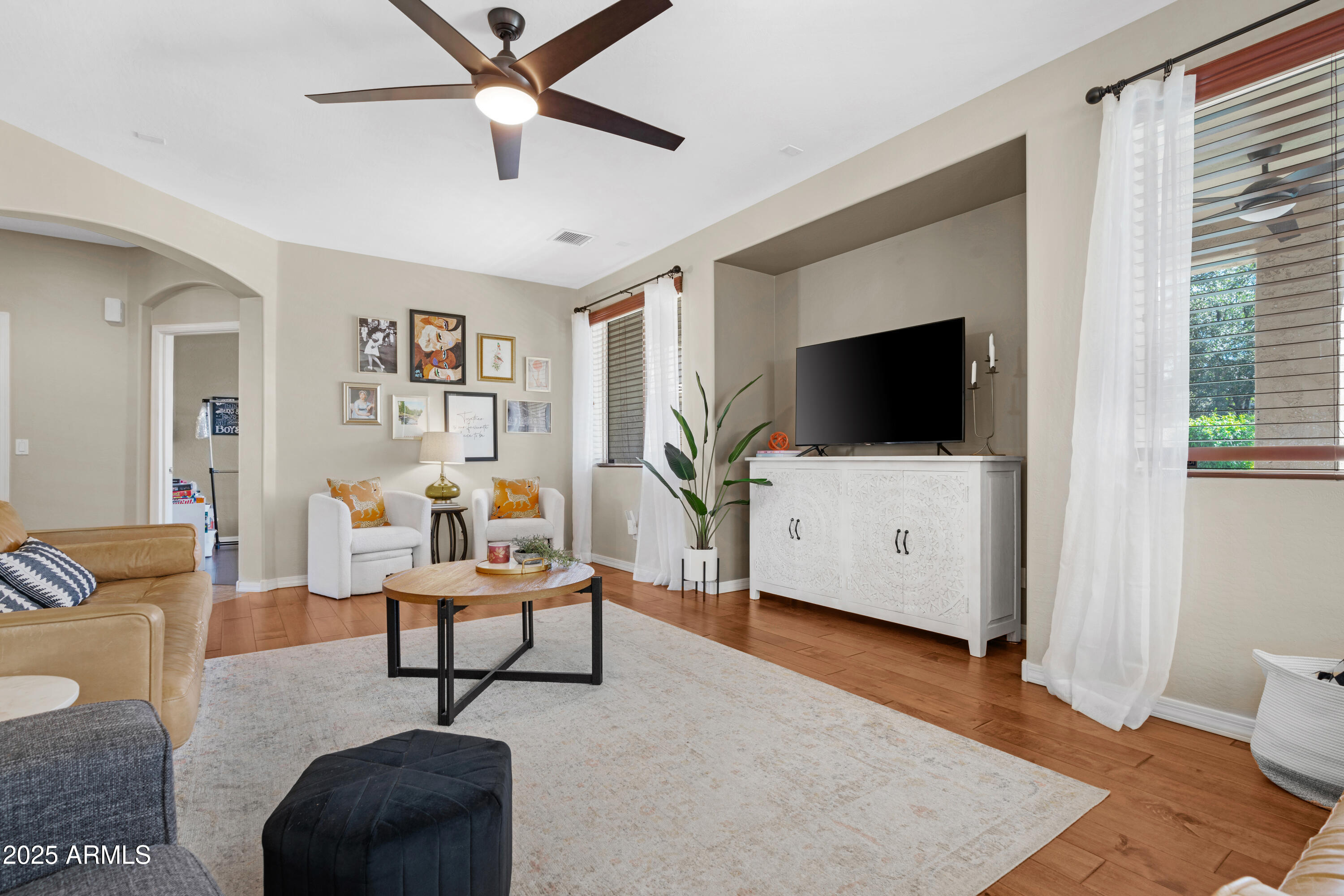 5419 West Tether Trail Phoenix, AZ 85083 - Photo 21 of 58 a living room with furniture and a flat screen tv