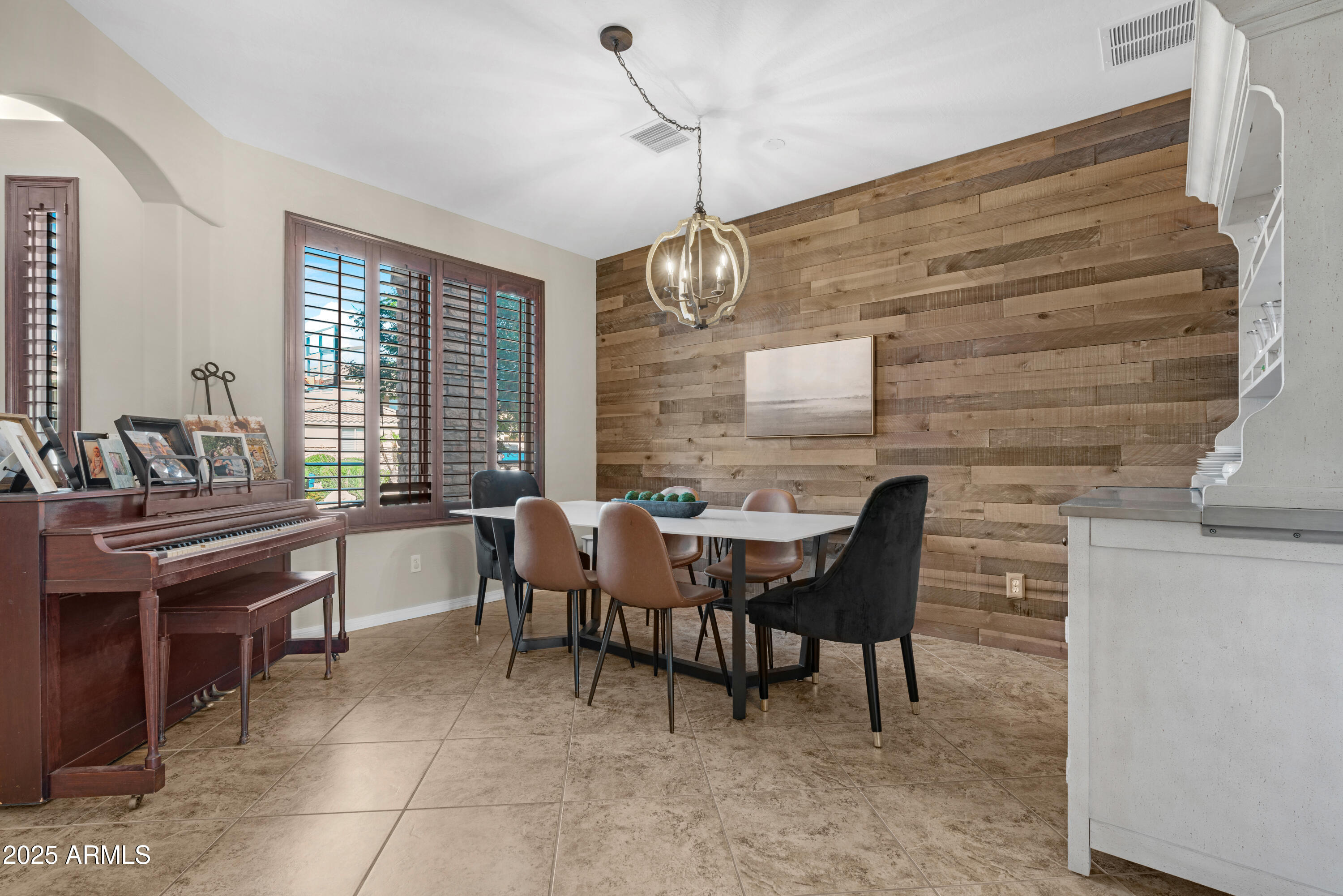5419 West Tether Trail Phoenix, AZ 85083 - Photo 23 of 58 a dining room with furniture and window