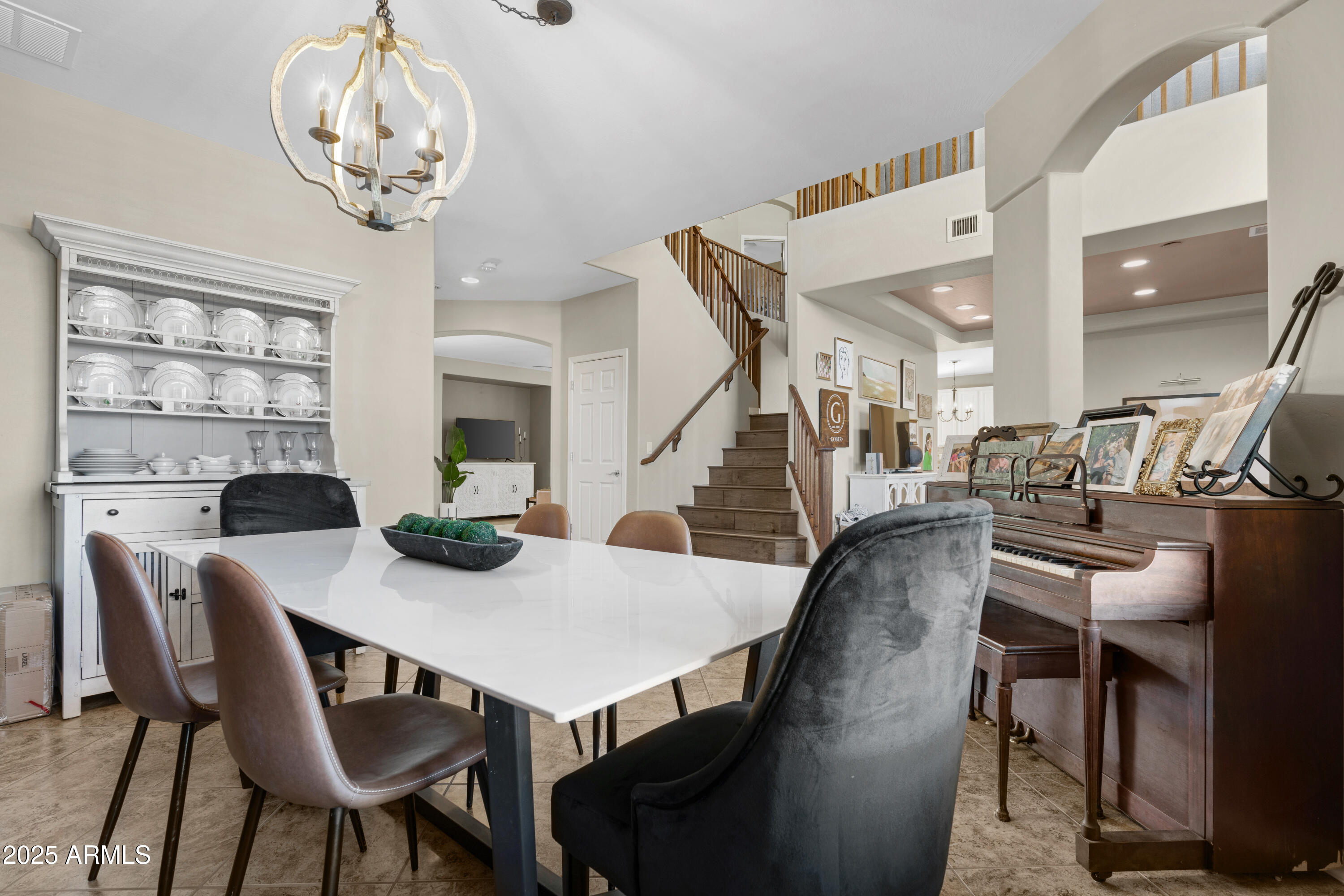 5419 West Tether Trail Phoenix, AZ 85083 - Photo 24 of 58 a view of a dining room with furniture and a chandelier