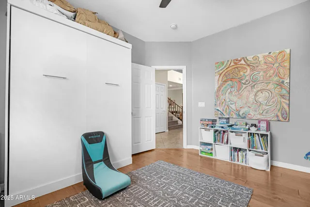 a bathroom with a sink mirror vanity and toilet