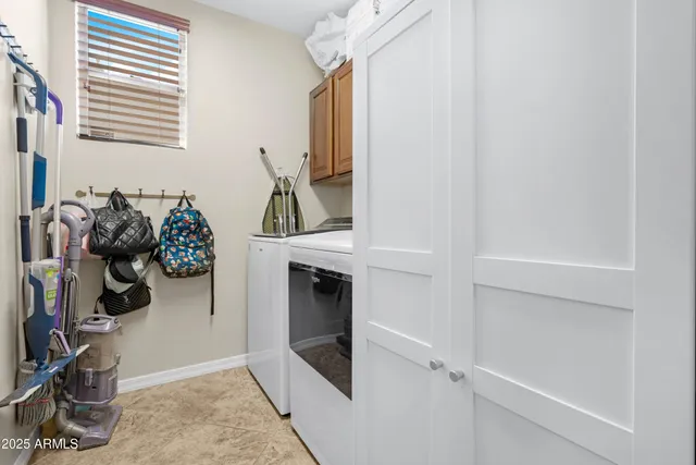 a view of a hallway with wooden floor and windows