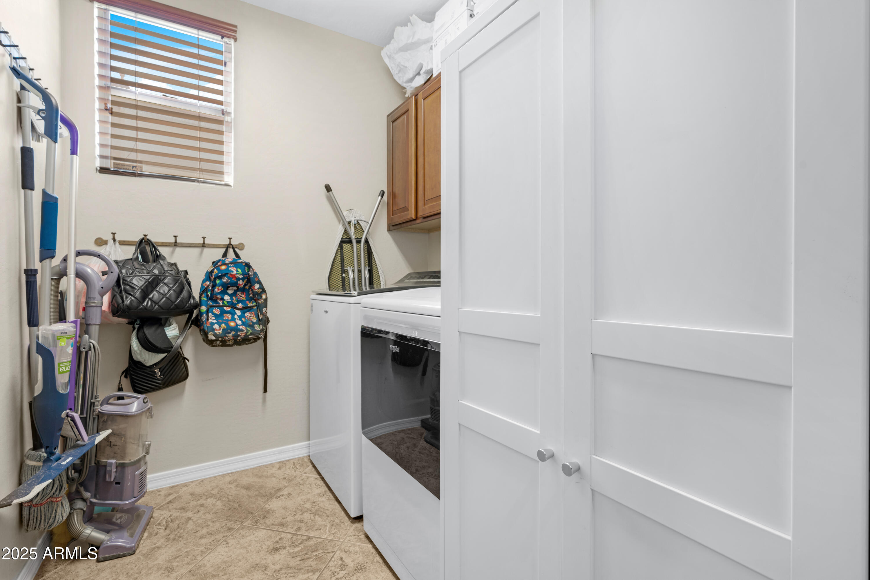 5419 West Tether Trail Phoenix, AZ 85083 - Photo 28 of 58 a view of walk in closet with clothes and shoes
