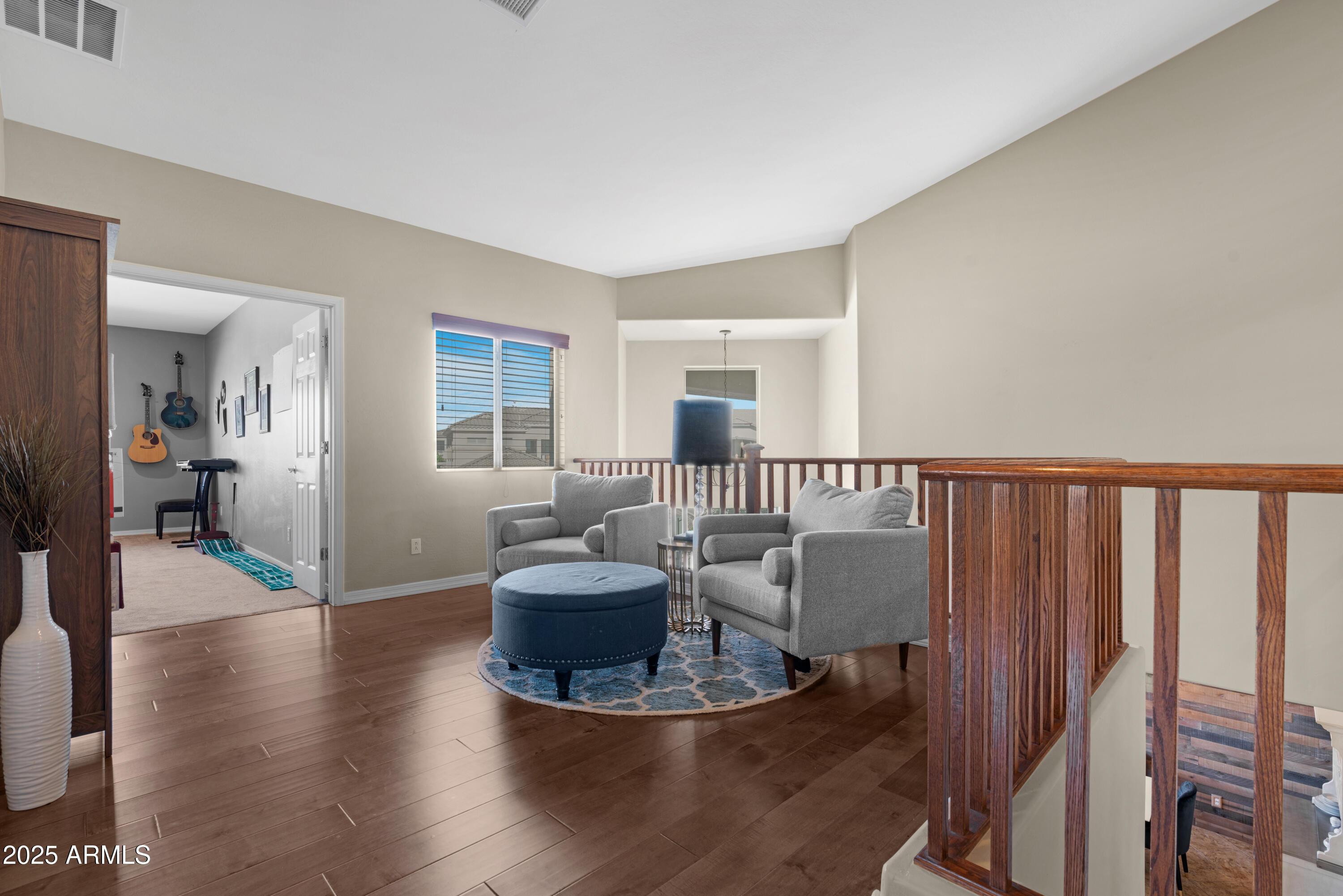 5419 West Tether Trail Phoenix, AZ 85083 - Photo 30 of 58 a living room with furniture and a wooden floor
