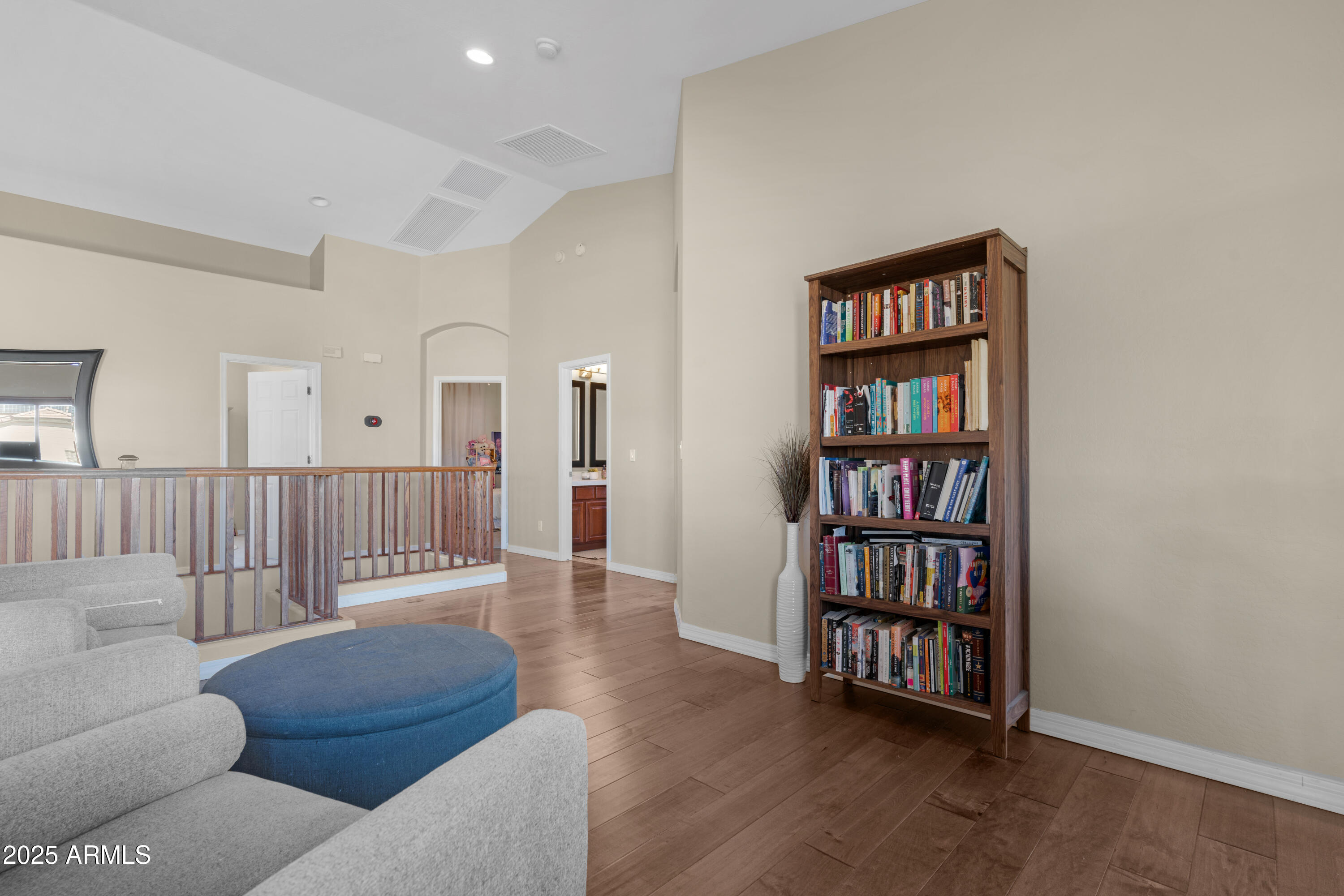 5419 West Tether Trail Phoenix, AZ 85083 - Photo 31 of 58 a living room with furniture and a book shelf
