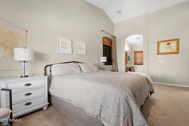 a bedroom with a bed and furniture