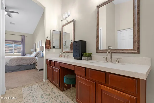 a bedroom with a bed and cabinets