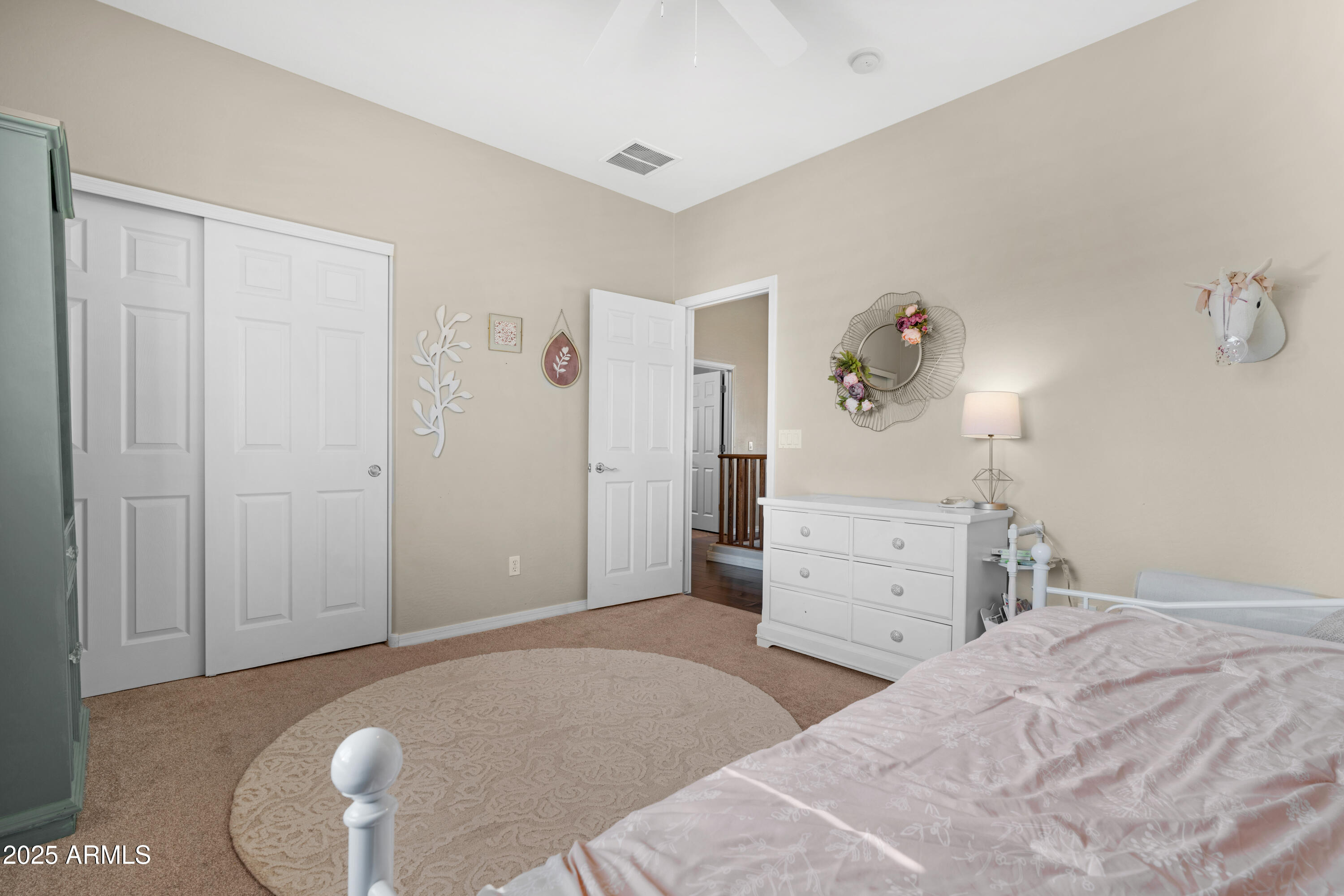 5419 West Tether Trail Phoenix, AZ 85083 - Photo 40 of 58 a bedroom with a bed and cabinets